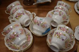 A selection of tea cups and saucers by Colclough in the Wayside design