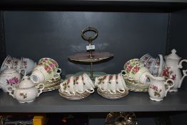 A selection of tea cups and saucers including Colclough and Winton cake plate