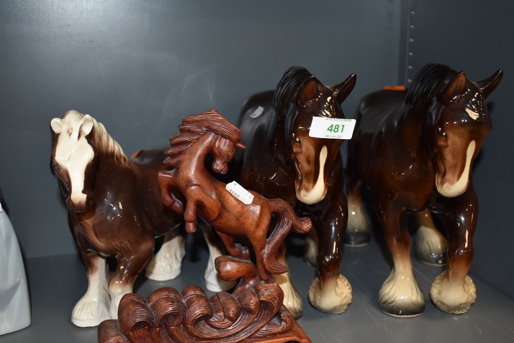 A selection of horse figures including large shire horse and Japanese style wooden carved figure