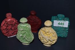 A selection of Chinese snuff bottles in cinnabar styles