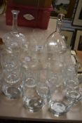 A selection of clear cut and etchen brandy glasses and two antique cut decanters