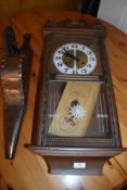 A traditional set of oak and copper bellows and a reproduction wall clock