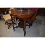 A Victorian mahogany occasional table having octagonal top and galleried undertier