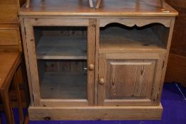 A natural pine entertainment or similar cabinet