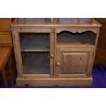 A natural pine entertainment or similar cabinet