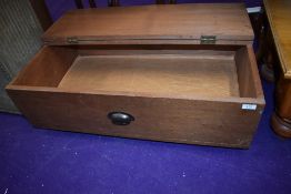 A vintage underbed or similar wheeled storage box