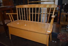 A beech and ply box seat of small proportions (childrens size) having spindle back, width approx.