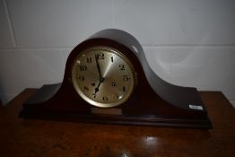 A 1920s mahogany Napoleon style mantel clock , with presentation plaque Lewis's 1927