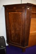 A 19th Century mahogany corner cabinet, having green painted shelves to the interior, with