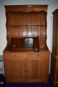 A vintage teak dresser of traditional form , shipped in by the owner from the Far East in the 1970s,