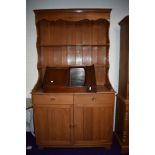 A vintage teak dresser of traditional form , shipped in by the owner from the Far East in the 1970s,