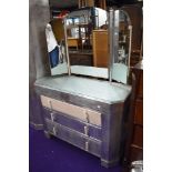 An Art Deco aluminium bedroom suite comprising large and small wardrobes, and dressing table, part