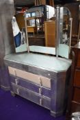 An Art Deco aluminium bedroom suite comprising large and small wardrobes, and dressing table, part