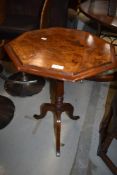 A wine or tea table having turned base with burr walnut veneer top