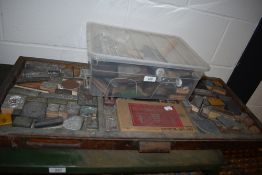 A selection of printers letter press picture and similar stamps with box of accessories