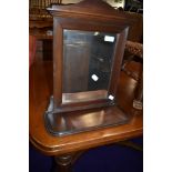 A late 19th or early 20th Century mahogany wall mirror, with undershelf, width approx. 36cm