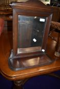 A late 19th or early 20th Century mahogany wall mirror, with undershelf, width approx. 36cm
