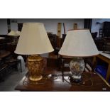 Two oriental styled table lamps one gold with rouge base and similar jar style