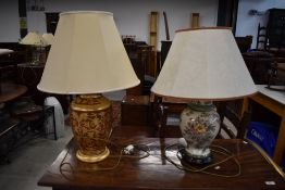 Two oriental styled table lamps one gold with rouge base and similar jar style