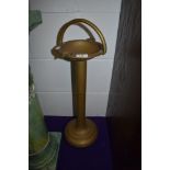 A brass smokers stand