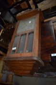 An Edwardian wall clock having oak case with silver effect face dial