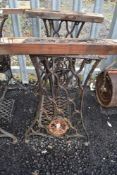 A Victorian cast iron sewing table base