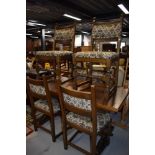 A dining room table and set of six chairs by Old Charm