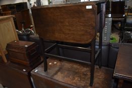 A small size drop leaf table having shaped frame work