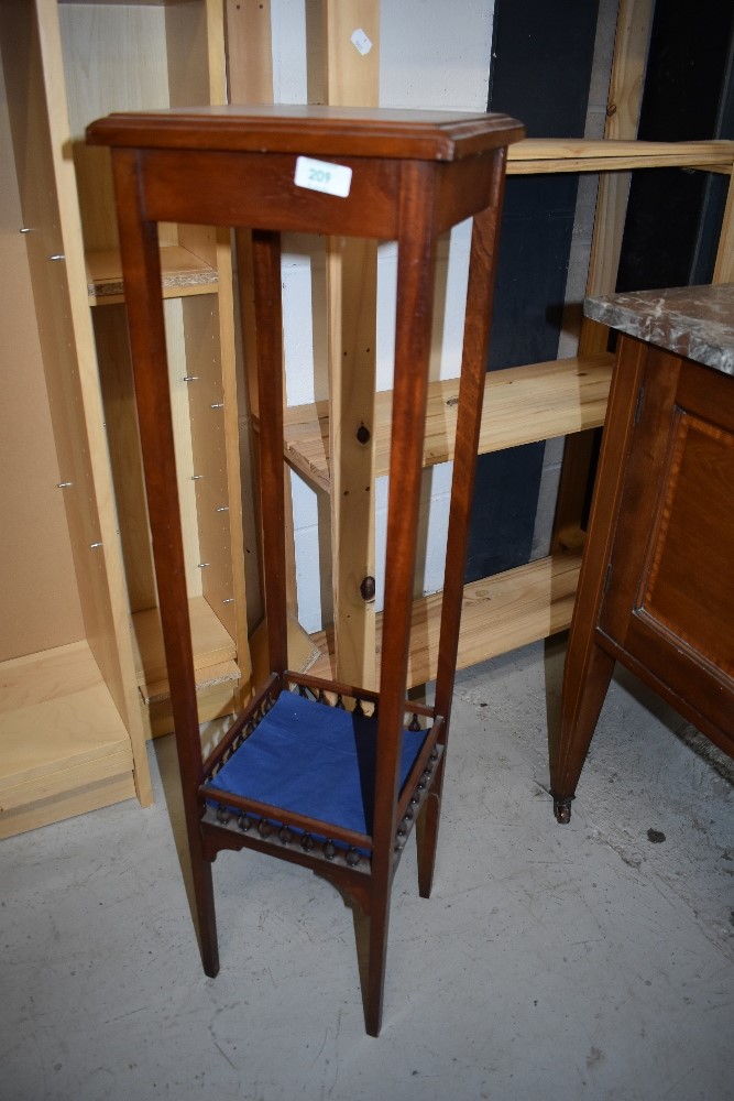 An Edwardian plant or similar stand having under shelf with mahogany frame