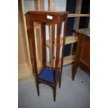 An Edwardian plant or similar stand having under shelf with mahogany frame