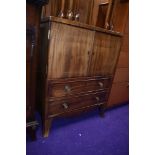 A reproduction Regency style TV cabinet, small proportions, would possibly work as a drinks cabinet