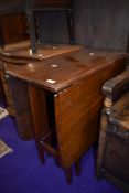 An early to mid 20th Century mahogany gate leg table