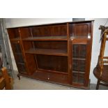 An early 20th Century mahogany bookcase, with narrow glazed display sections to each side, width