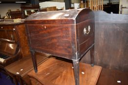 A Regency mahogany and inlaid dome top cellarette, having brass handles and tapered legs, no