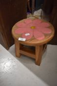 A traidtional stool with painted flower decoration