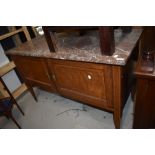 A Victorian wash stand having double under cupboard with pink marble top and mahogany frame with