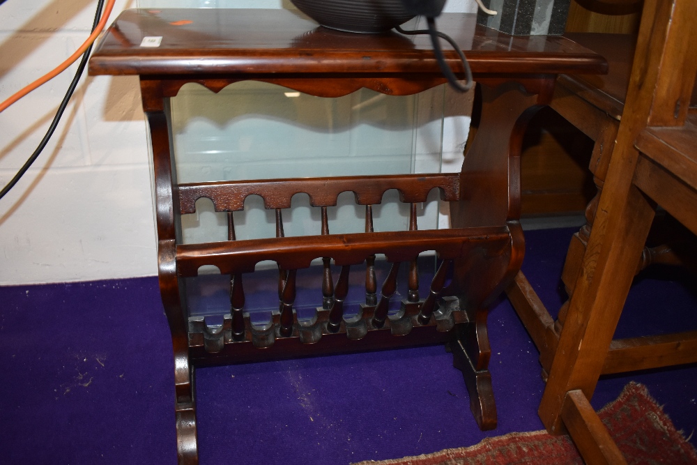 A reproduction mahogany magazine table