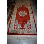 A Chinese style hall way rug with dragon decoration on red ground