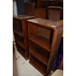 A pair of rustic bookcases