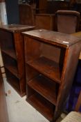 A pair of rustic bookcases