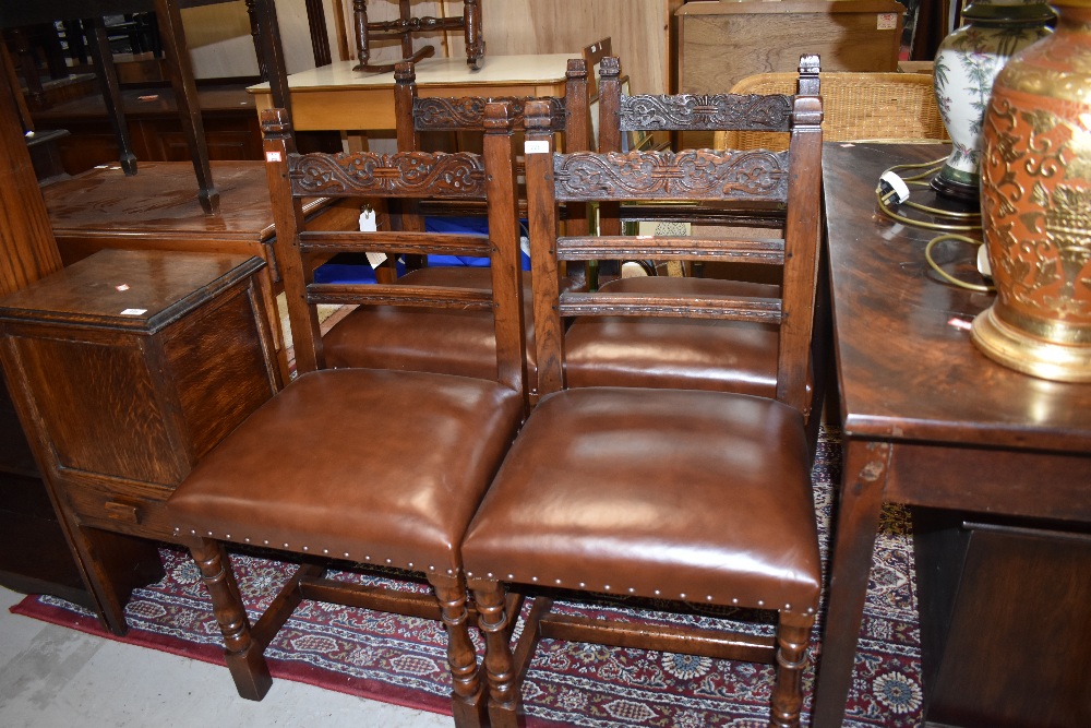 A set of four traditional carved back oak framed chairs having pegged frames , by Titchmarsh and