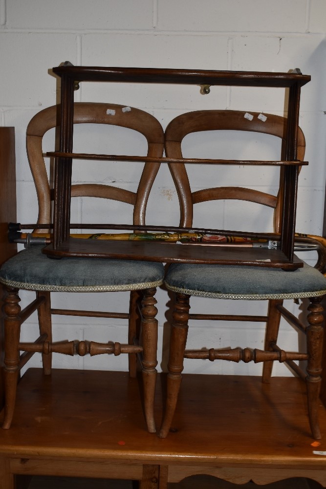 A late 19th/early 20th Century mahogany wall shelf, waterfall style with spindle ends, width approx.