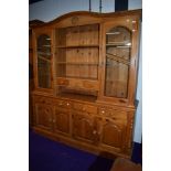 A natural pine kitchen dresser having glazed display top, width approx. 183cm