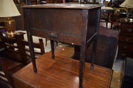 A small side table having open lift top and internal drawer