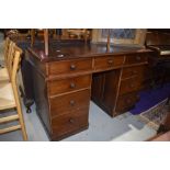 An early 20th Century stained frame pedestal desk