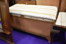 A vintage woven fibre bedding box