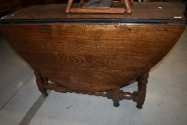 A Period oak gateleg dining table having bobbin turned style frame