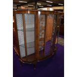 An early to mid 20th Century walnut demi lune display cabinet