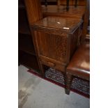 An Edwardian sewing side table having open lined top compartment with internal drawer