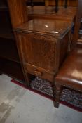 An Edwardian sewing side table having open lined top compartment with internal drawer